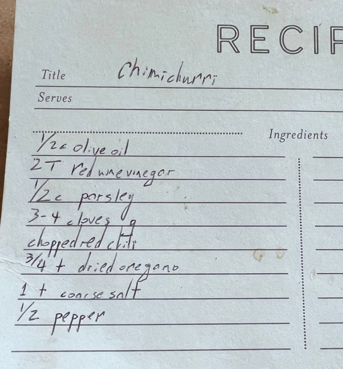 Handwritten chimichurri recipe card listing 3-4 cloves g and 1/2 pepper